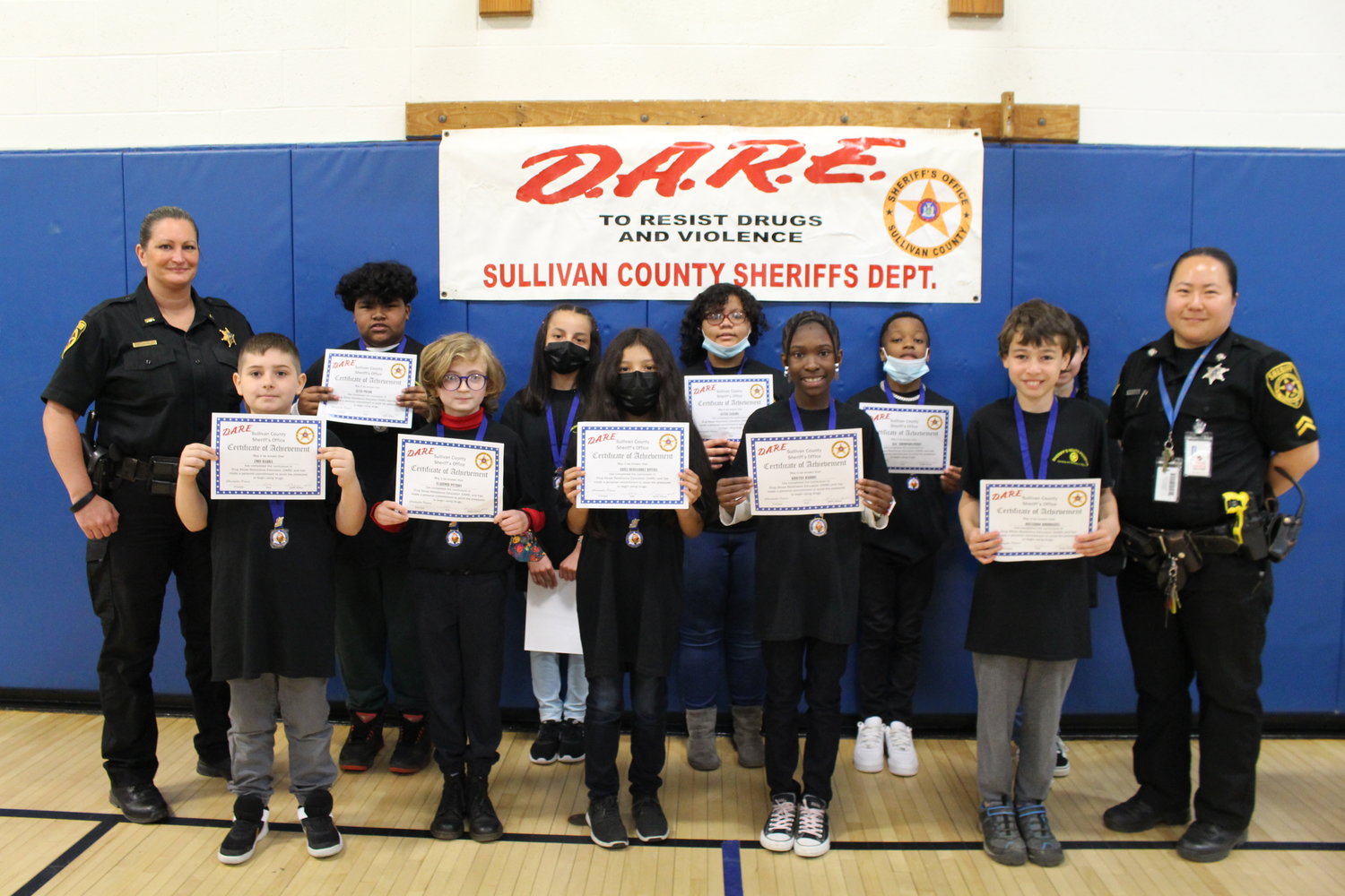 Rutherford School DARE graduates and essay winners are pictured with Lt.  Cheryl Crumley and Cpl. Rose Ionta, both from the county Sheriff's Department.